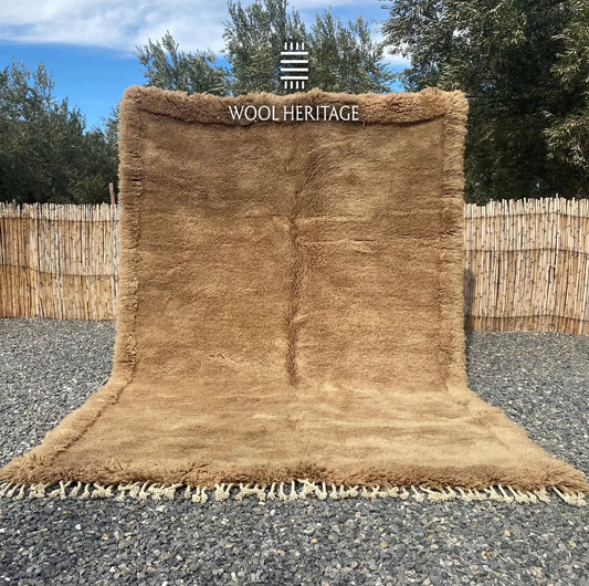 ASIREM hand-knotted camel Moroccan wool rug displayed outdoors in a full front view