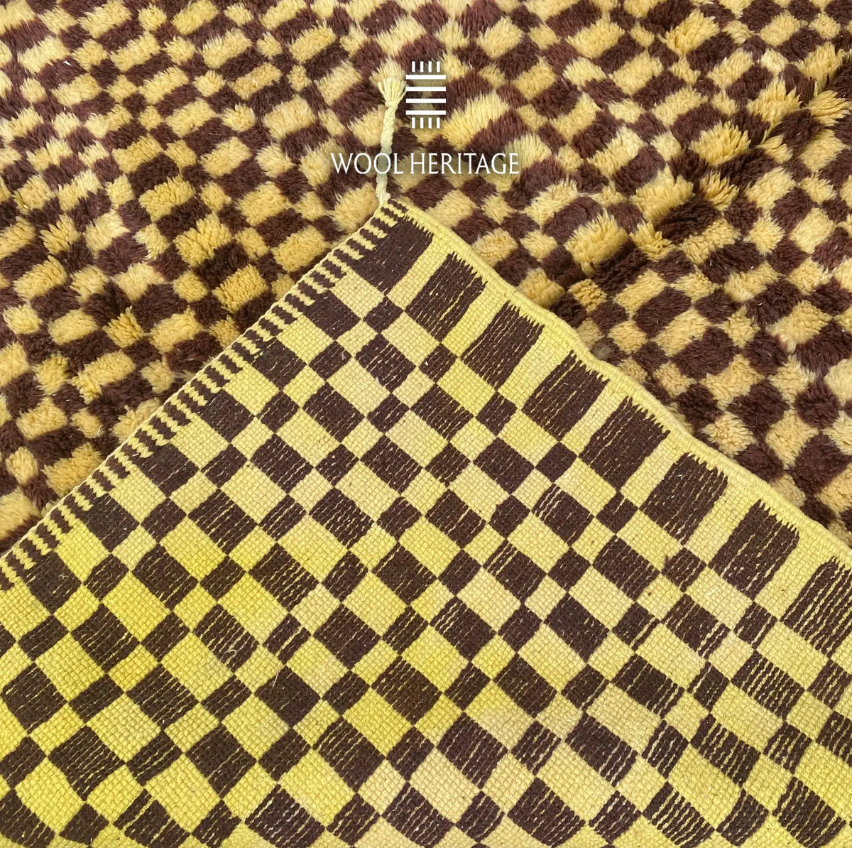 Back of TIZWIT Moroccan rug showing the woven checkerboard construction and finished edge