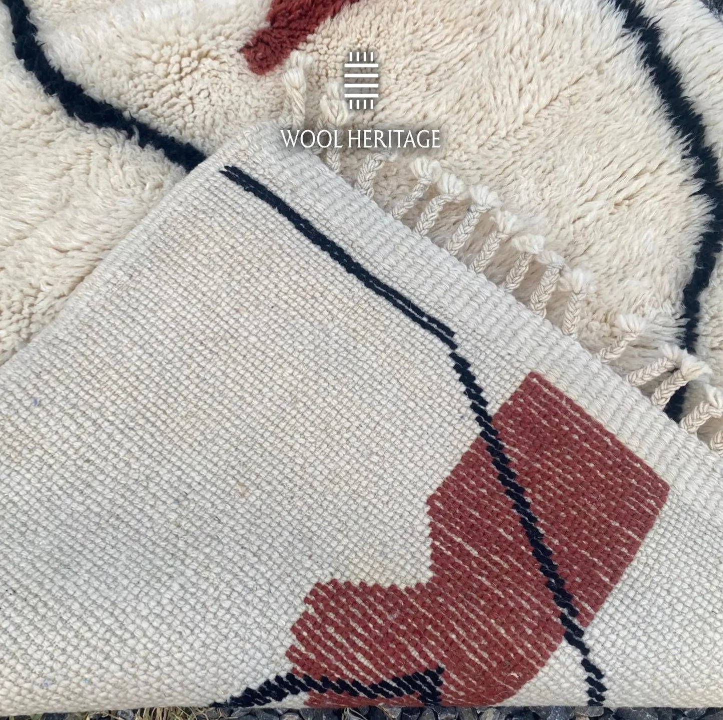 Back of AMARG Beni Mrirt rug showing its woven construction, burgundy colourwork, black line, and fringe finish