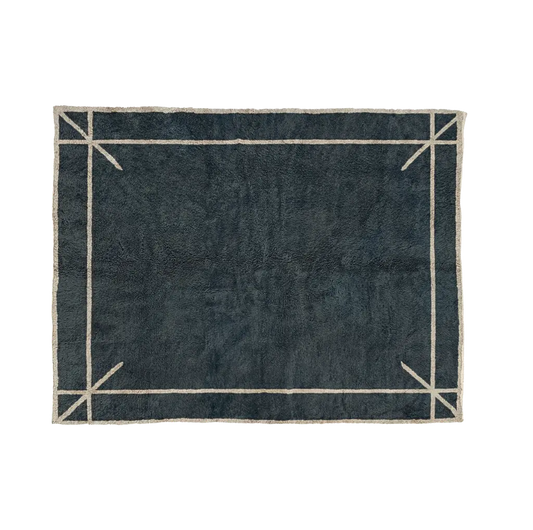 ASMA storm blue Beni Mrirt rug with a thin ivory border and marked corners, hand-knotted in M’rirt from Moroccan wool