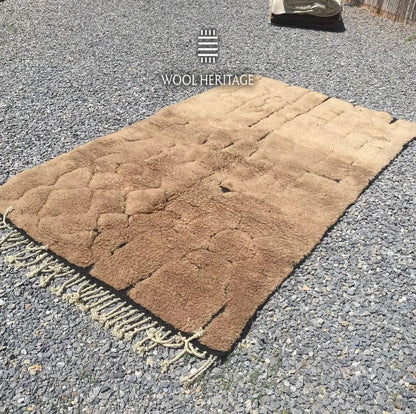 AZAGHAR camel-brown Moroccan wool rug shown at an angle with sculptural raised sections