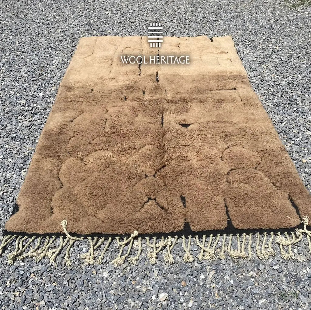 AZAGHAR camel-brown Beni Mrirt rug laid flat, showing its irregular high-low textured design