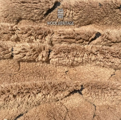 Close-up of AZAGHAR camel-brown wool pile and raised abstract texture