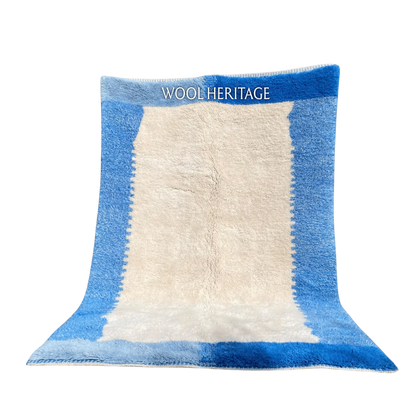 IGENNA blue and ivory Beni Mrirt rug with a layered sky-blue and cobalt border in an isolated product view