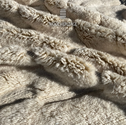 Detailed view of IGHREM Beni Mrirt rug showing the soft hand-knotted wool pile and sculpted relief