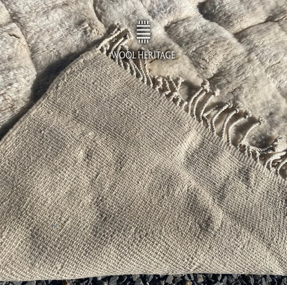 Back of IGHREM hand-knotted Moroccan rug showing its woven construction and fringe finish