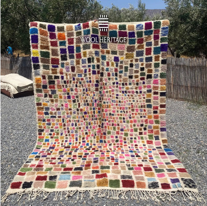 TAFSUT hand-knotted multicolour Moroccan wool rug displayed outdoors in a full front view with hand-finished fringe