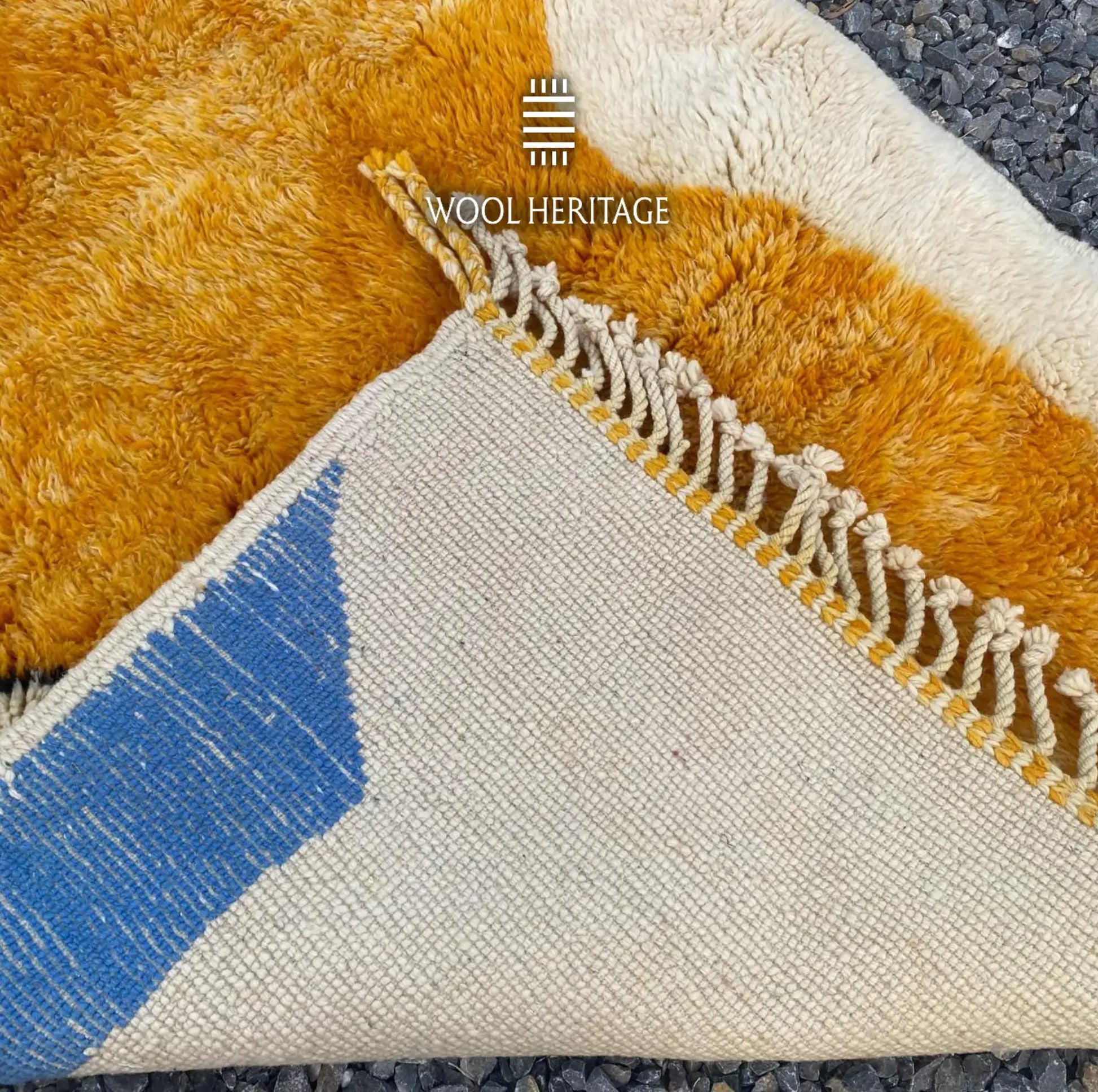 Back of TAMURT hand-knotted Moroccan rug showing the woven construction, colourwork, and hand-finished fringe