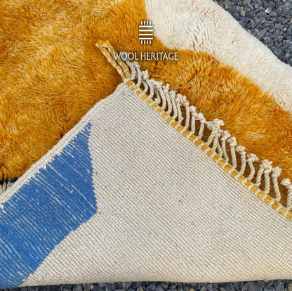 Back of TAMURT hand-knotted Moroccan rug showing the woven construction, colourwork, and hand-finished fringe