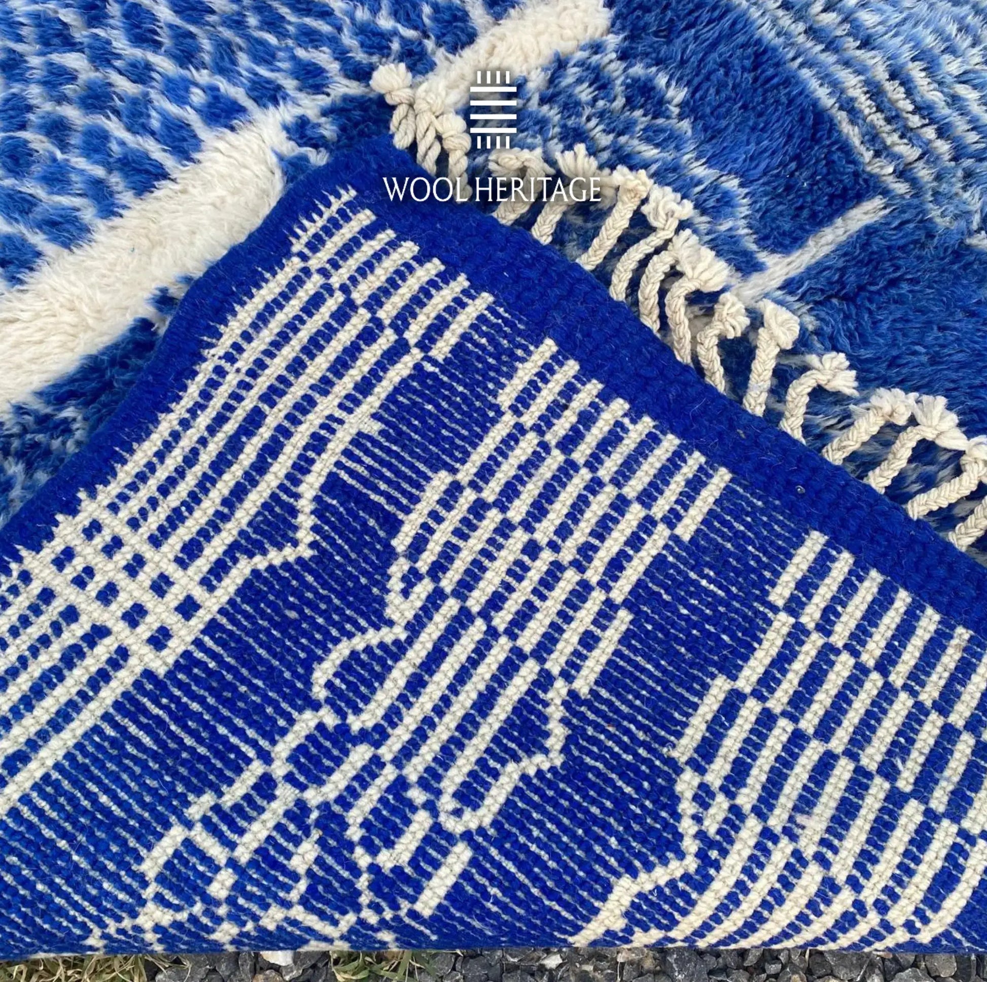 Back of TARGA Moroccan rug showing the woven cobalt-blue and ivory pattern, finished edge, and fringe