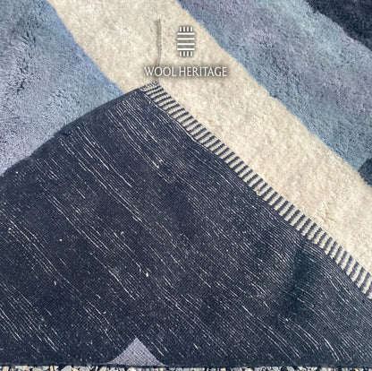 Back of TAWWURT Beni Mrirt rug showing its woven construction and navy, pale blue, and ivory colourwork