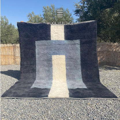 TAWWURT hand-knotted blue and ivory Moroccan wool rug displayed outdoors in a full front view