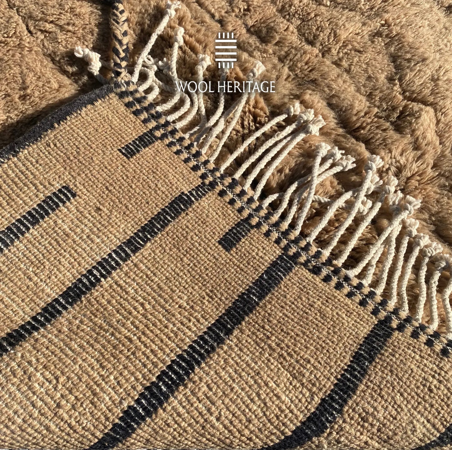 Back of TIRRA hand-knotted Moroccan rug showing its woven construction, dark lines, and fringe finish