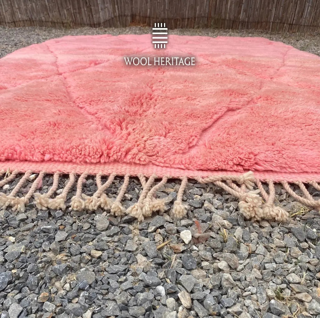 Close-up of TISLIT’s coral-pink pile and hand-finished fringe