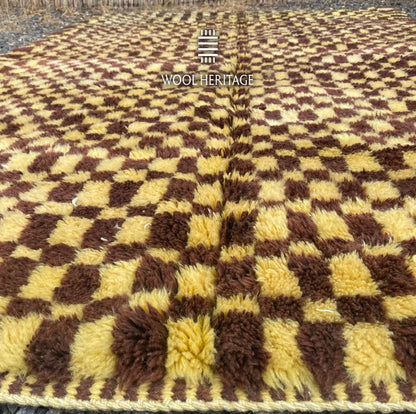 Low-angle detail of TIZWIT Beni Mrirt rug showing the soft pile and changing checker proportions
