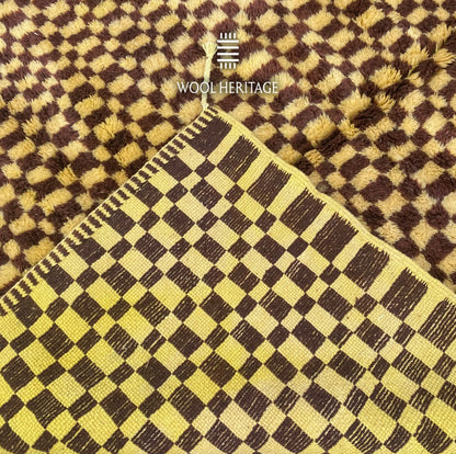 Back of TIZWIT Moroccan rug showing the woven checkerboard construction and finished edge