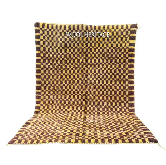 TIZWIT golden-yellow and brown Beni Mrirt rug with an irregular checkerboard in an isolated product view